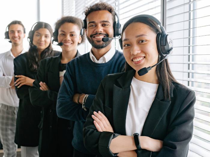 Customer support team wearing headsets